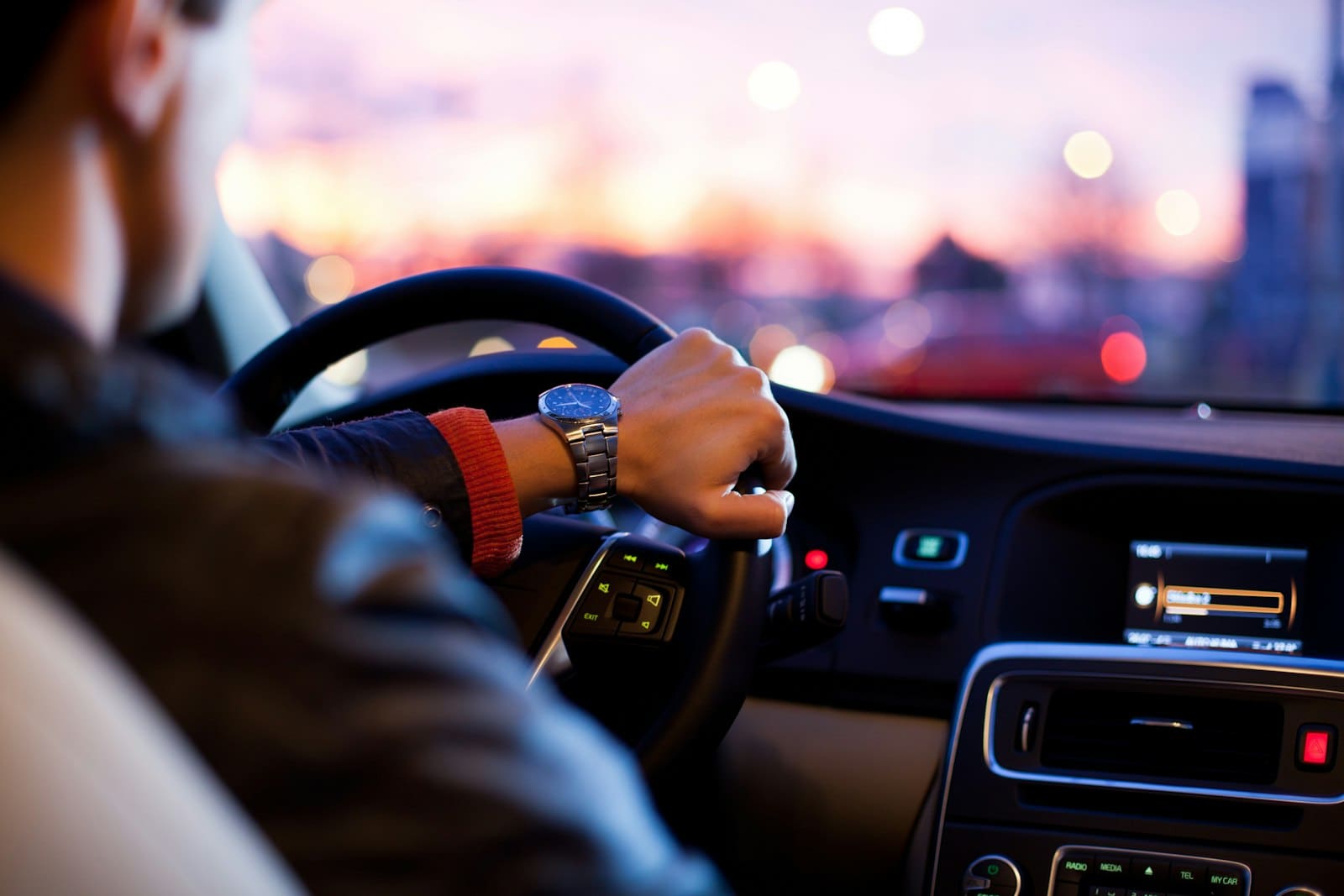 Driver at the wheel of a modern passenger vehicle